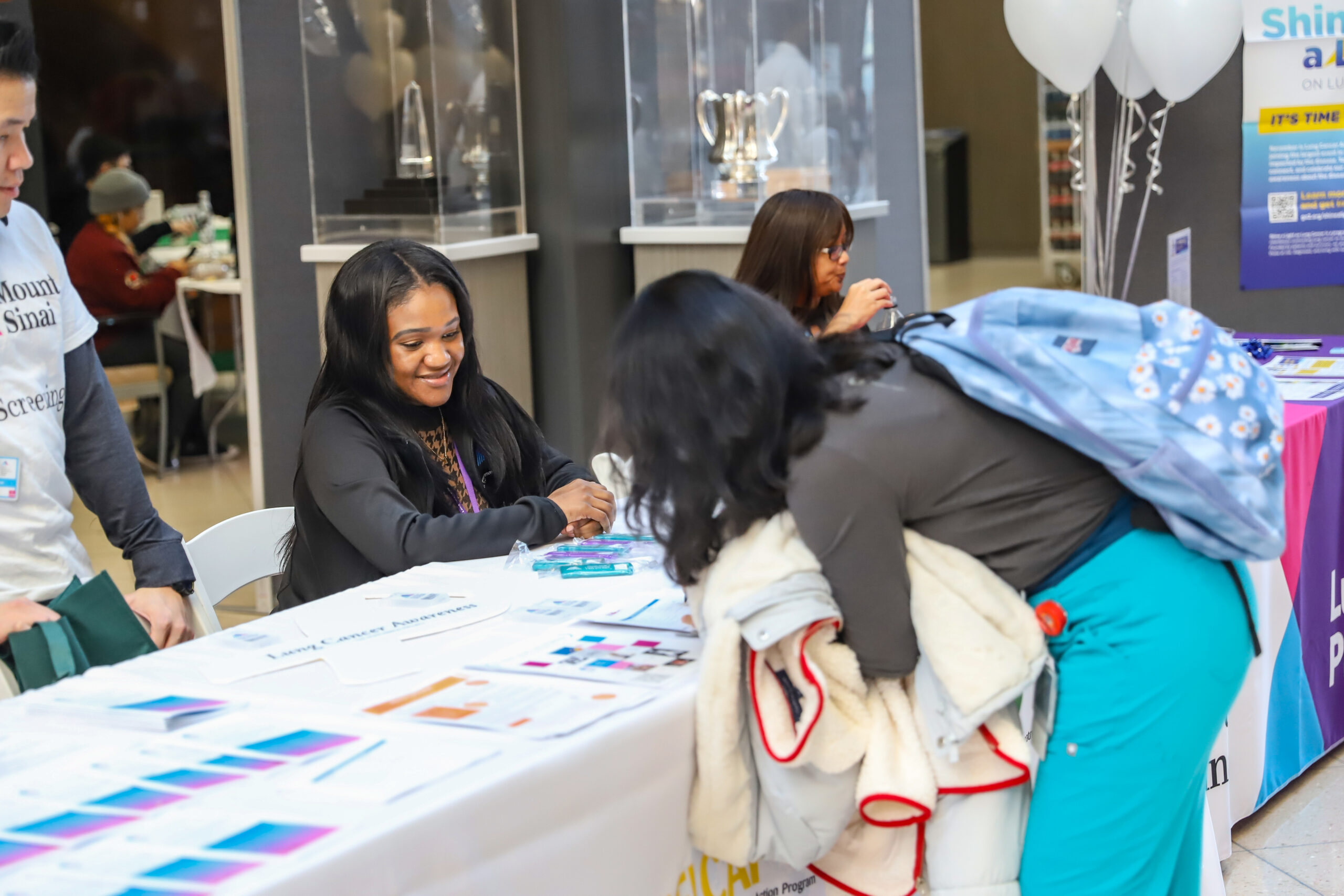 Clinical Research Coordinator discussing early lung cancer screening. Photo by Roger Britton.
