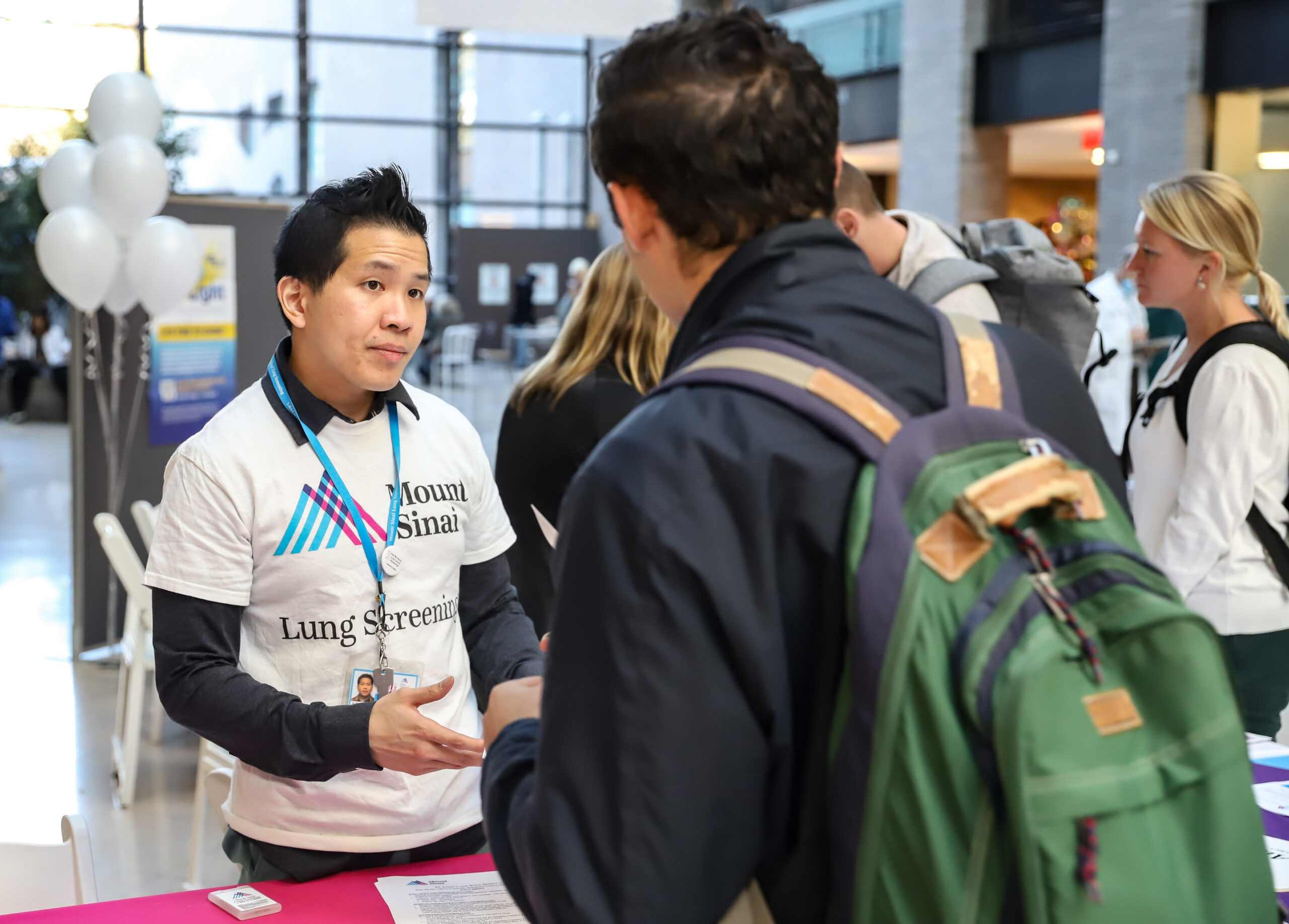 Clinical Research Coordinator discussing early lung cancer screening. Photo by Roger Britton.