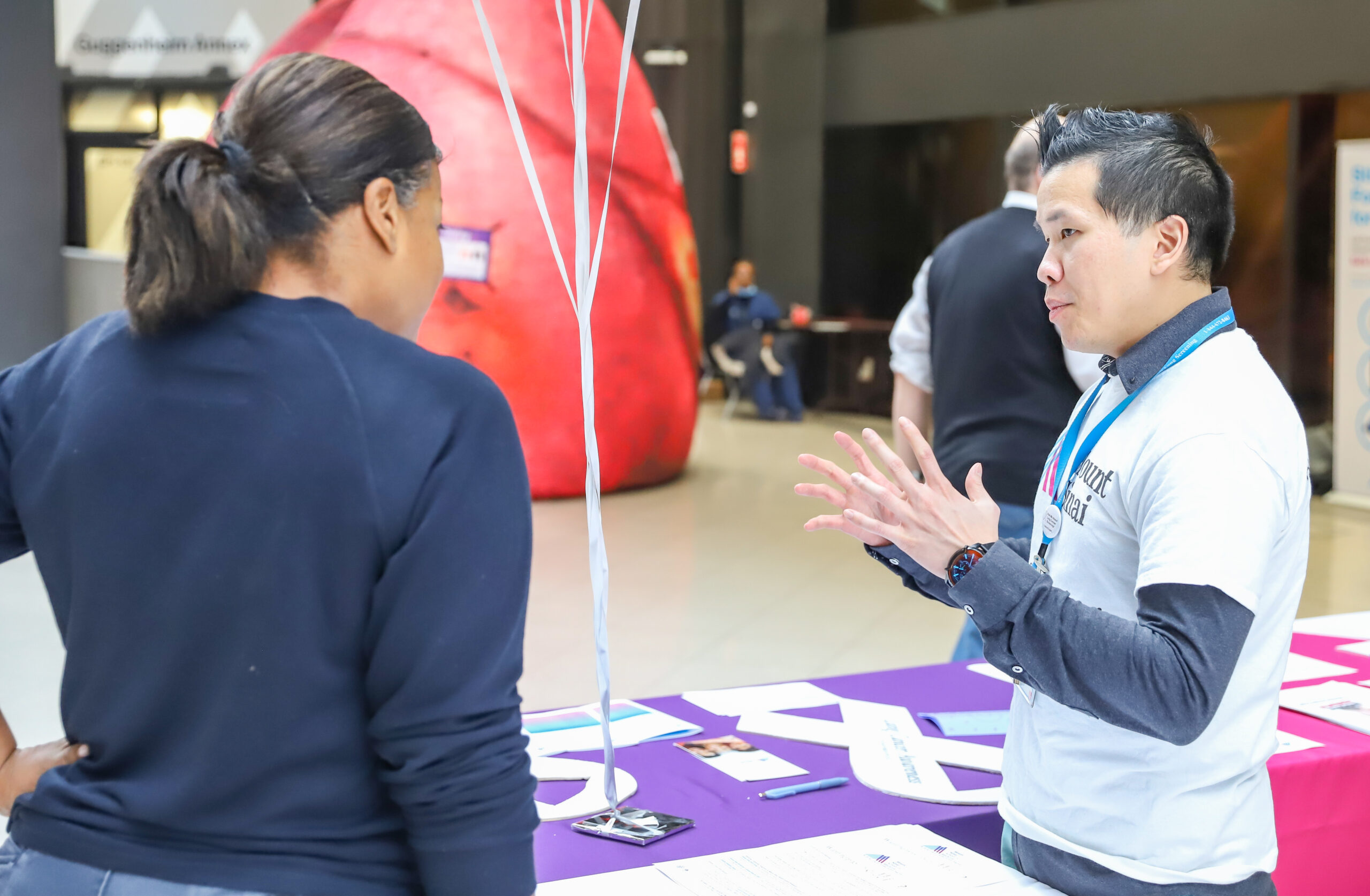Clinical Research Coordinator discussing early lung cancer screening. Photo by Roger Britton.